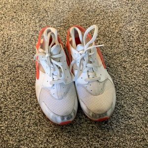 White and pink Nike shoes